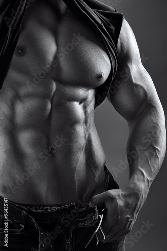 black and white image of a muscular male torso