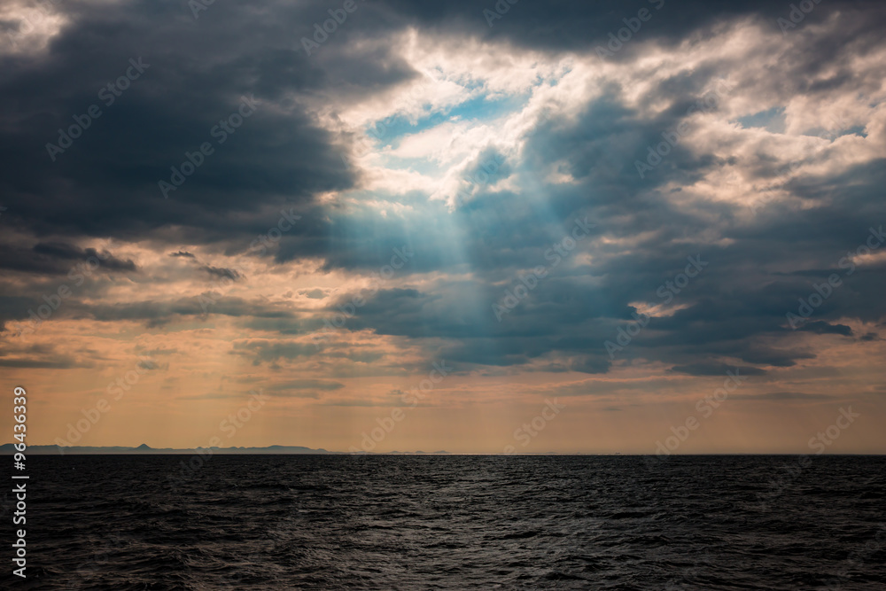 Sunbeams breaking through stormy skies in Iceland. 