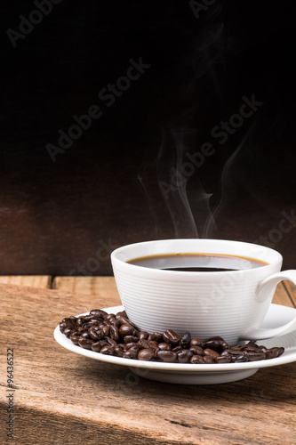 Coffee cup and saucer on a wooden table