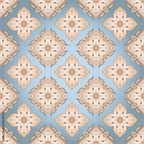 Seamless floral beige texture on blue.