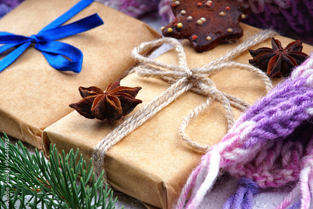 Christmas gift boxes, fir tree branch and winter scarf Christmas gift boxes, fir tree branch and winter scarf