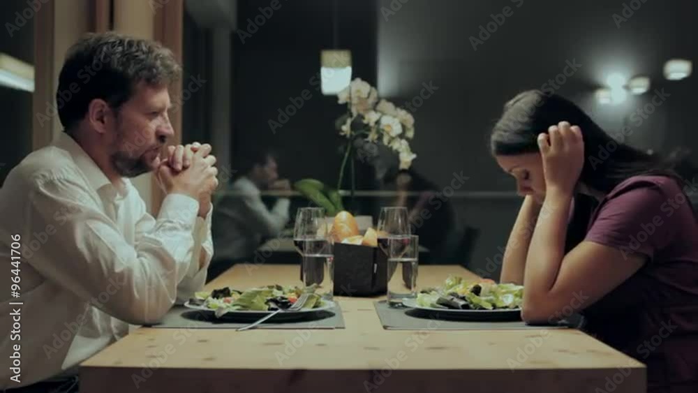 Woman crying during dinner with husband Woman crying during dinner with husband