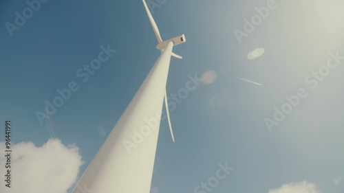Wind mill turbines blades rotating generating power photo