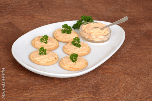 plate crackers with salmon pate and parsley