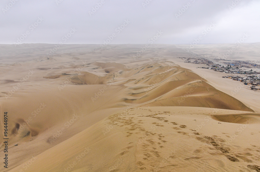 Village on the border of the Huacachina desert, Peru Village on the border of the Huacachina desert, Peru