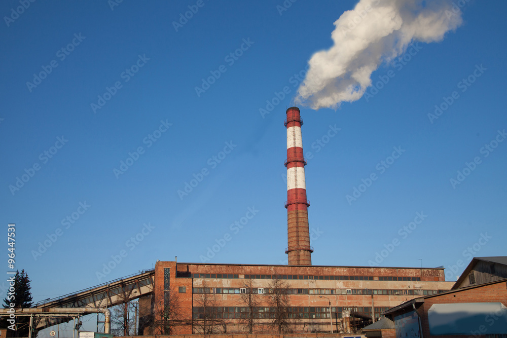 smoke from the chimney of the boiler house