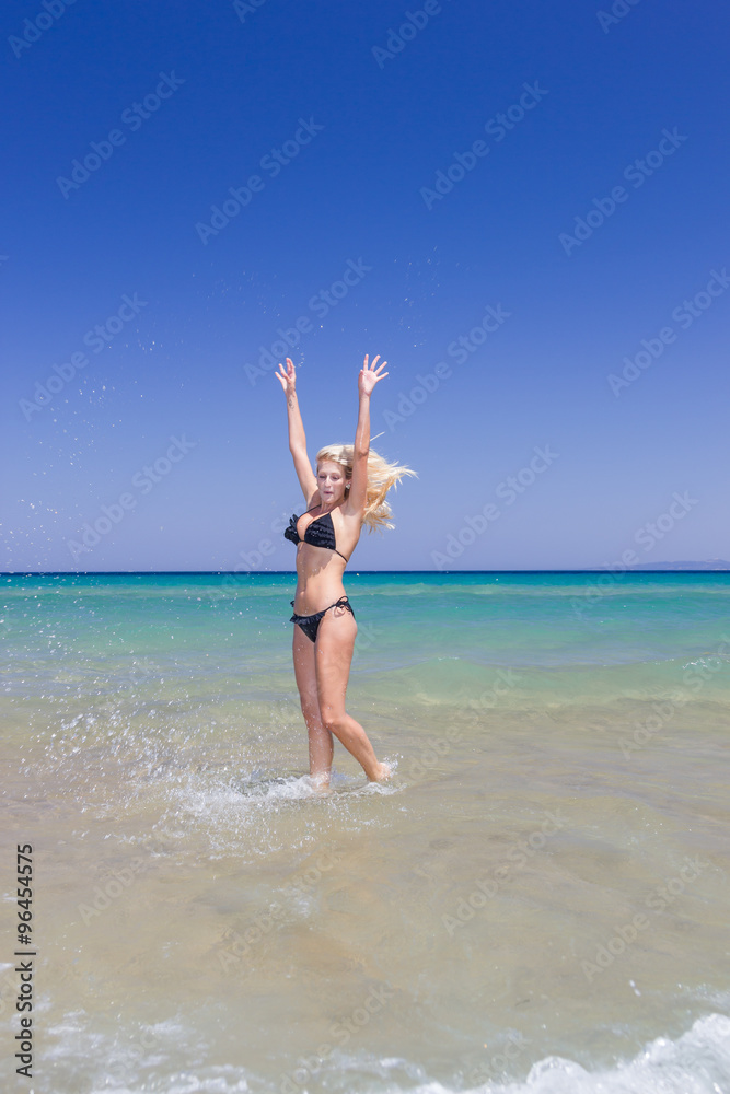 Beautiful slender blonde at the sea