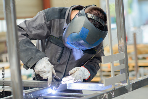 welder with blow torch photo