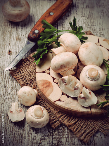 Fototapeta Naklejka Na Ścianę i Meble -  Raw champignon mushroom on wooden background