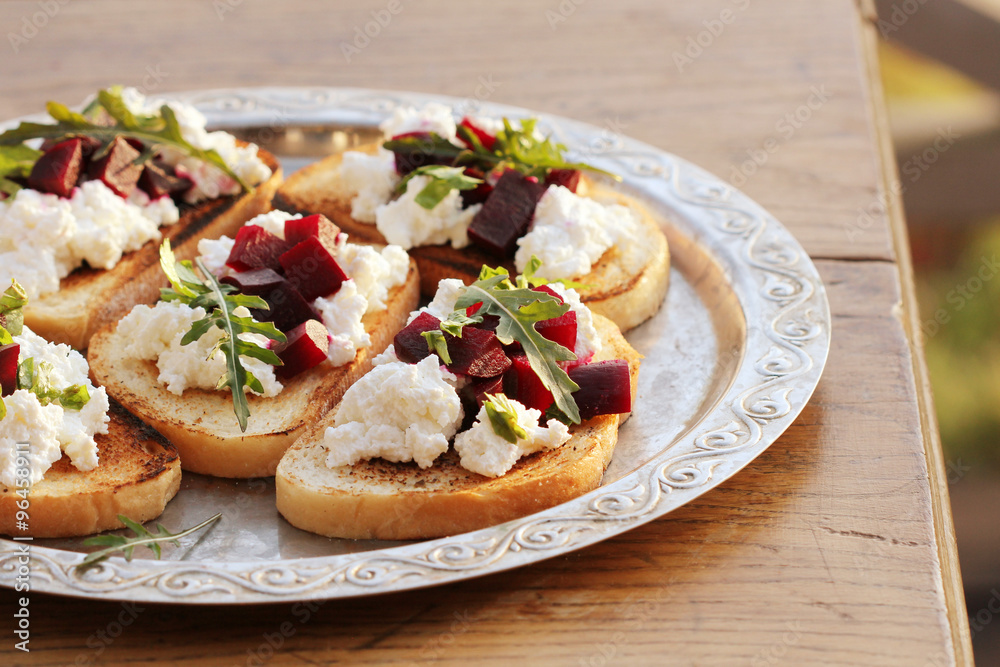 Bruschetta with beet, feta and ruccola