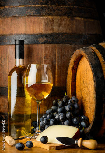 white wine on wooden barrel background
