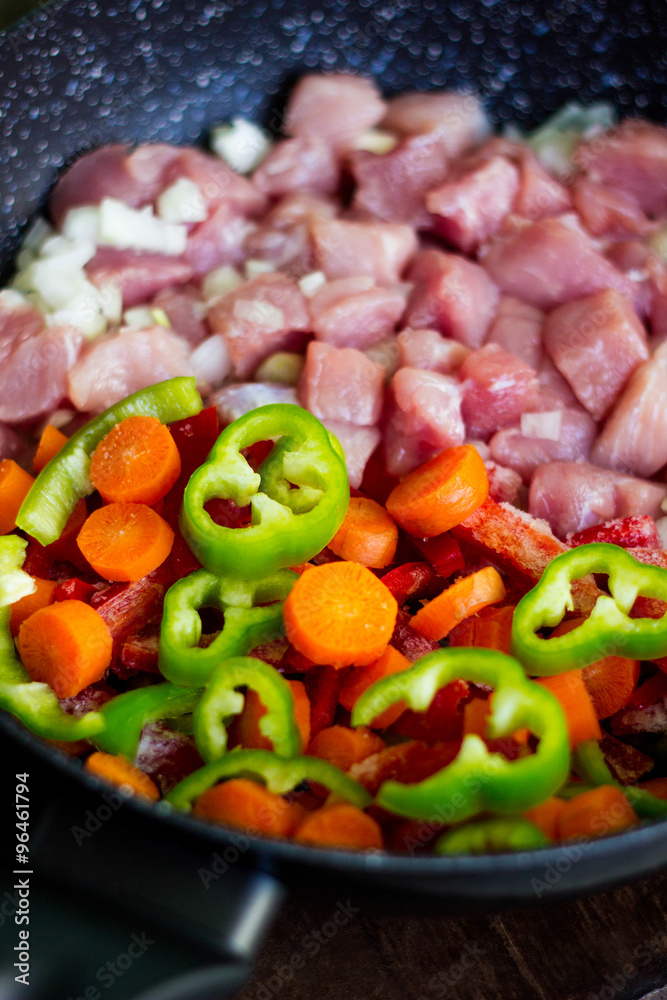 Miixed vegetables and meat in a wok Miixed vegetables and meat in a wok