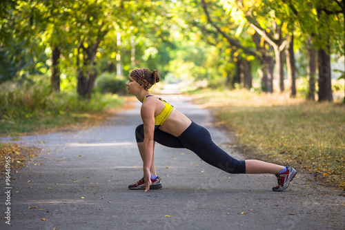 Fitness woman doing streching during outdoor cross training workout