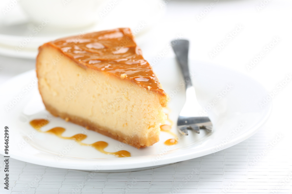 Fresh and tasty caramel cheesecake on white plate Fresh and tasty caramel cheesecake on white plate