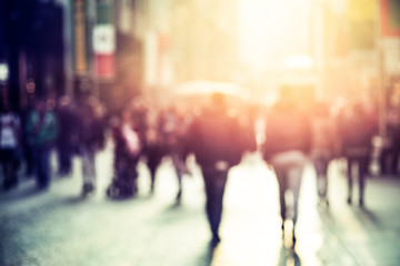 people walking in the street, blurry
