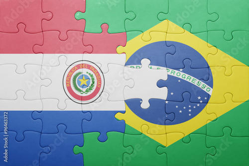 puzzle with the national flag of brazil and paraguay photo