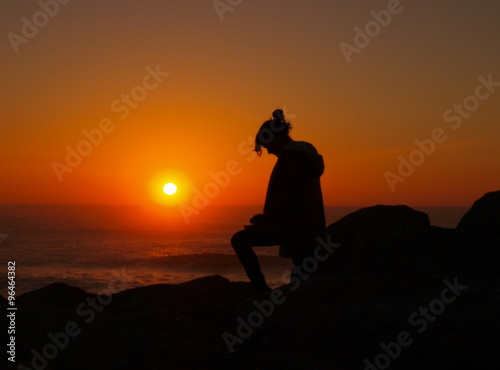 her silhouette at sunset
