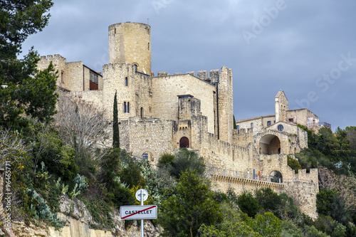 Castle at Castellet i la Gornal from lake. Catalonia photo
