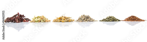 Dried herbal tea leaves, lavender, rooibos, chamomile, linden flower, hibiscus, Japanese green tea over white background photo