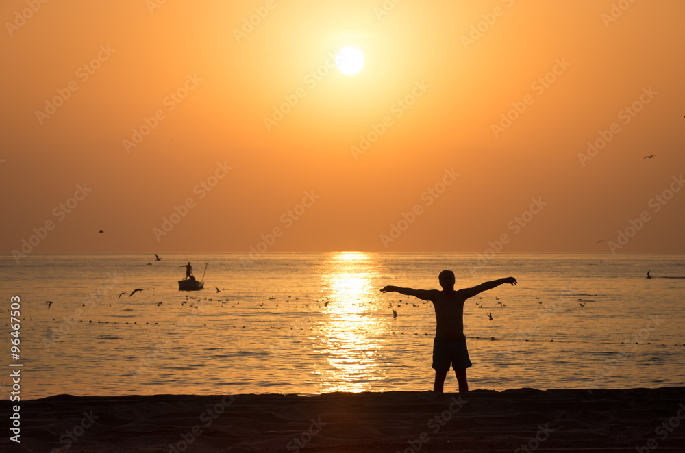 Gymnastic on the sunrise beach in Sarjah UAE