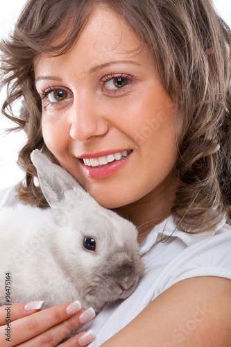 Young woman kissing rabbit © ivanmateev