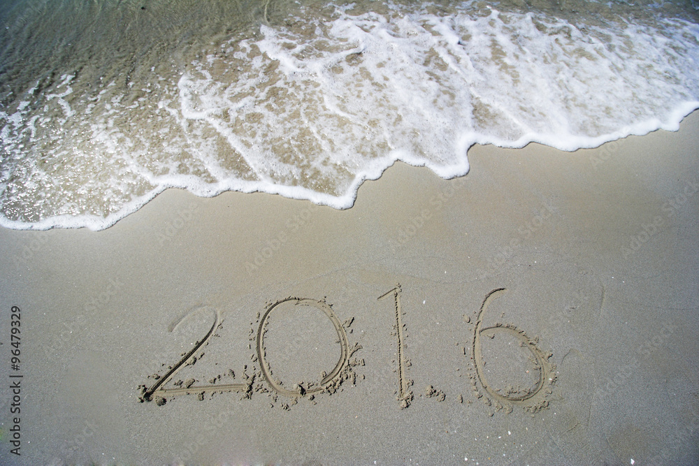 Happy New Year 2016 concept on the sea beach Happy New Year 2016 concept on the sea beach