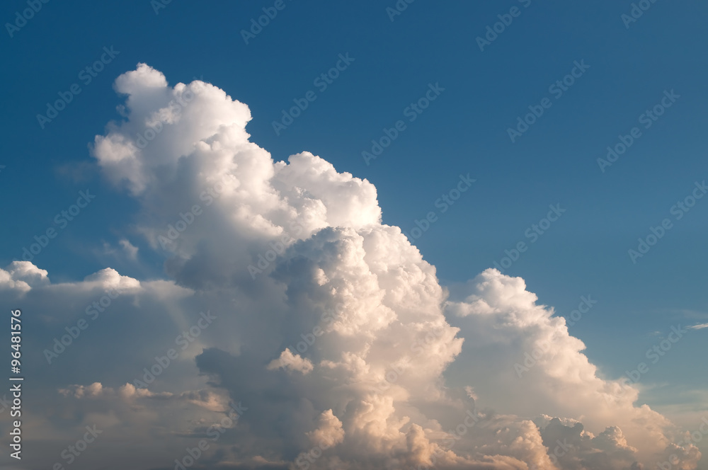 Huge cloud cluster in sunset light Huge cloud cluster in sunset light