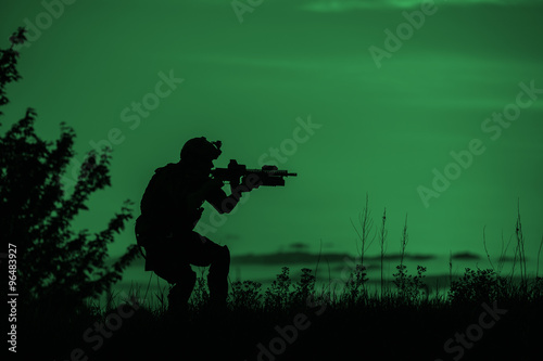 Silhouette of soldier with rifle.