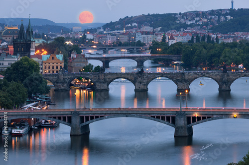 Prague cityscape and full moon