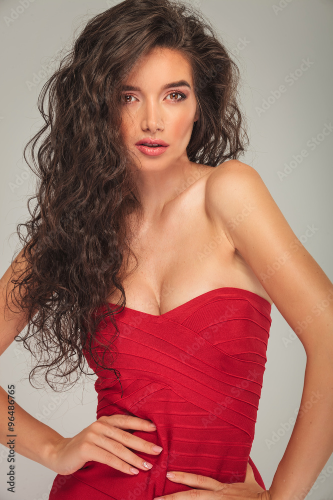 busty-model-with-long-hair-posing-stock-photo-adobe-stock