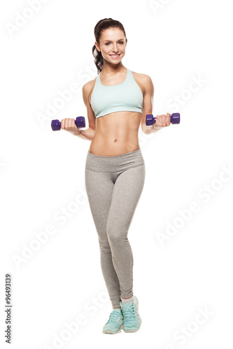 sporty woman do her workout with dumbbells, isolated on white background