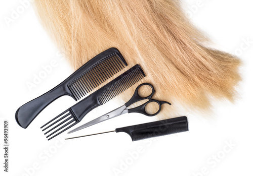 hair with scissors on close up isolated on white background