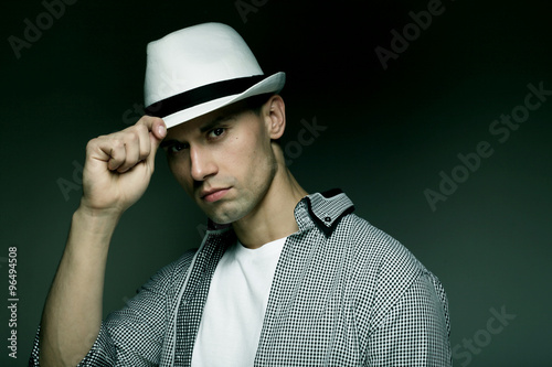 young casual man with hat
