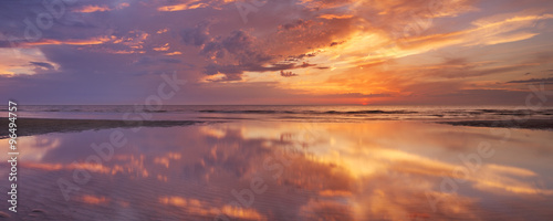 Sunset reflections on the beach, Texel island, The Netherlands