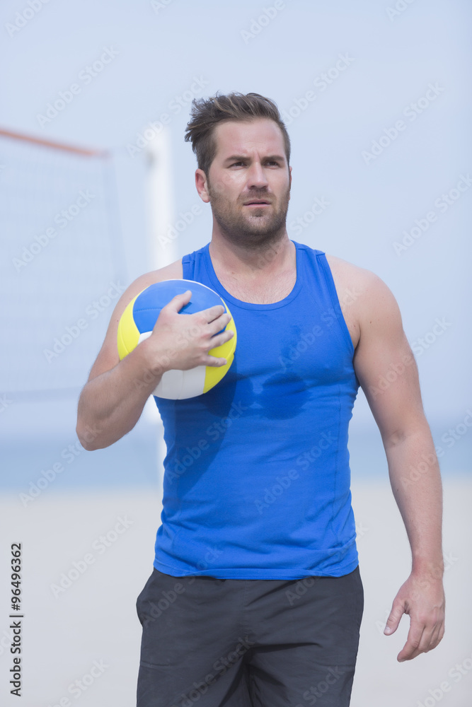 beach volley player and ball.