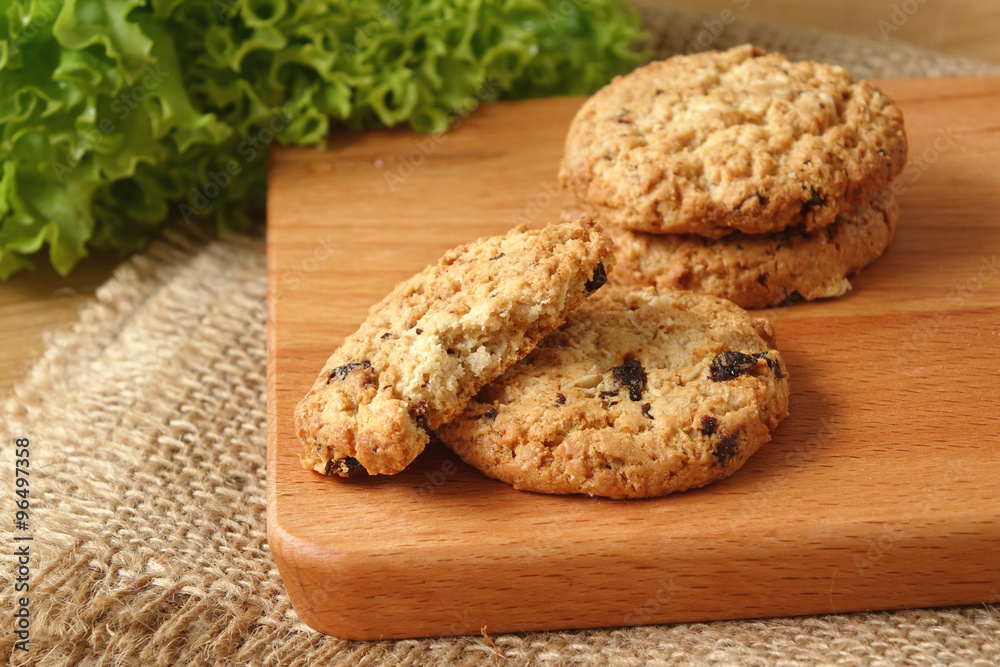 Oat raisin cookies on chopping board Oat raisin cookies on chopping board