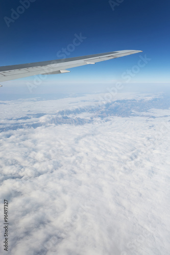   Above the clouds.Wing aircraft in the sky under earth of Tibeth. photo
