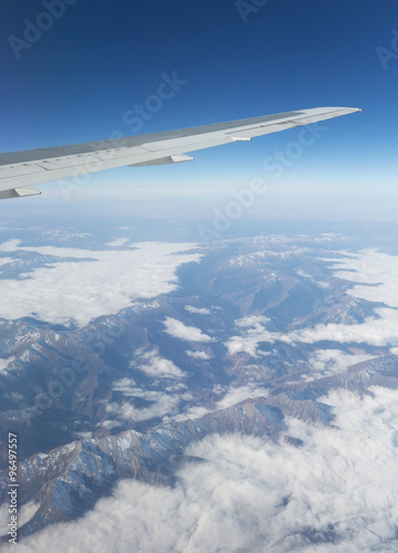   Above the clouds.Wing aircraft in the sky under earth of Tibeth. photo