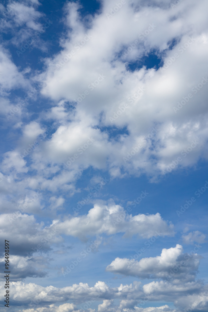 Obraz premium Cloudscape over horizon. Blue sky and white clouds.