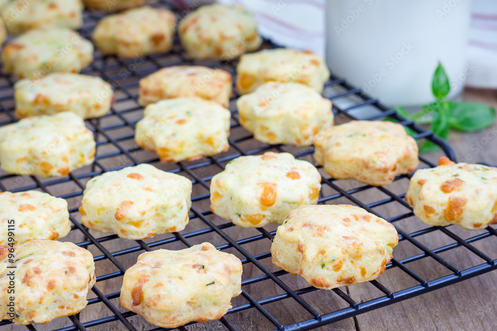 Fresh baked cheese cookies with basil, closeup Fresh baked cheese cookies with basil, closeup