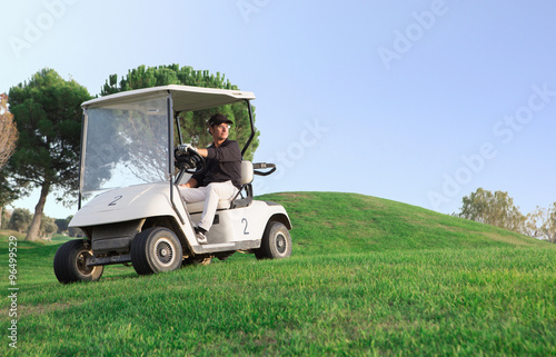 Man in golf cart.