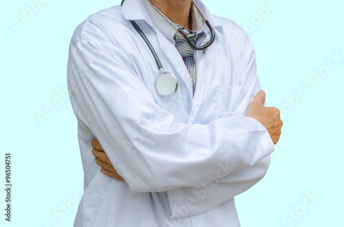 Doctor with stethoscope standing with arms crossed isolated on a blue