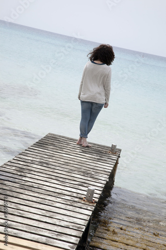 Woman on Pier and Jetty, Valencians Beach; Formentera photo