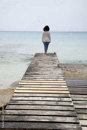 Woman on Pier and Jetty, Valencians Beach; Formentera