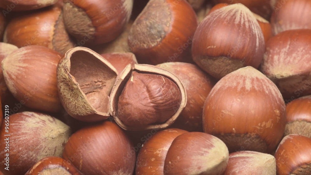 A pile of shelled hazelnuts rotating smoothly. Tripod used under studio lighting. A pile of shelled hazelnuts rotating smoothly. Tripod used under studio lighting.