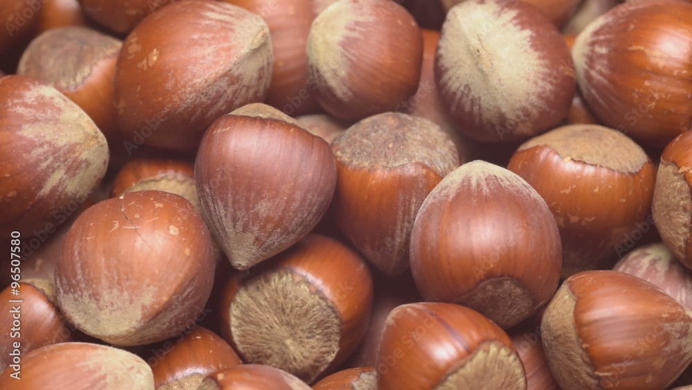 A pile of shelled hazelnuts rotating smoothly. Tripod used under studio lighting. A pile of shelled hazelnuts rotating smoothly. Tripod used under studio lighting.