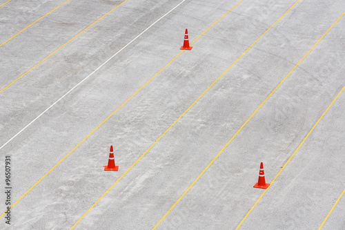 Concrete parking lot with traffic cones