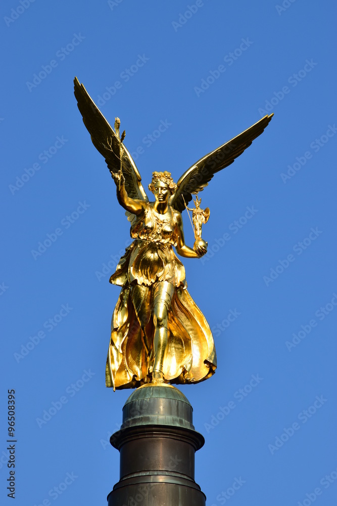 Fototapeta premium MUNICH, GERMANY - Gilded statue featuring a Peace Angel (Friedensengel) on the top of a column
