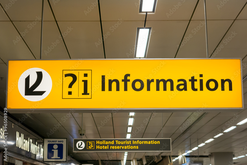 Information and tourism signs in arrivals terminal of Schiphol Amsterdam Airport, Netherlands