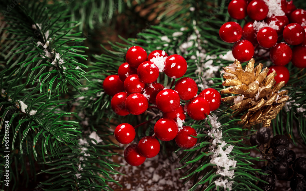 Fototapeta premium Beautiful Christmas background with the branches of the Christmas tree and snow on wooden background. View with copy space